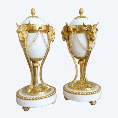 Pair of Louis XVI style marble ormolu cassolettes with upside-down candlesticks