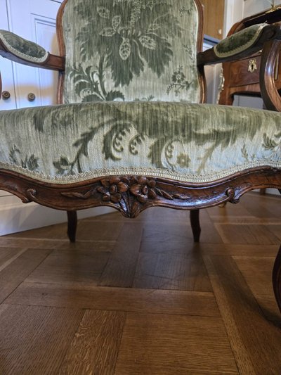 Pair of walnut "à la reine" armchairs, Louis XV period