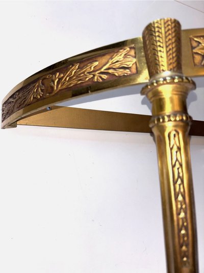 Louis XVI style floating half-moon console with marble top and chased brass structure