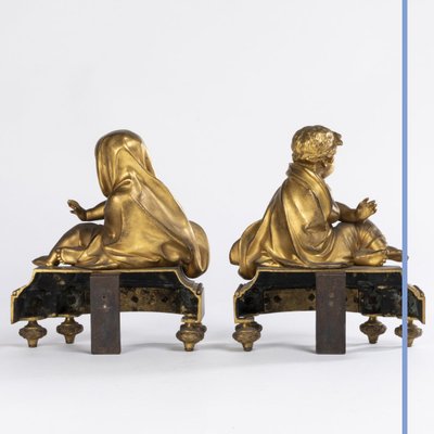 Pair of small ormolu andirons with putti, 19th century