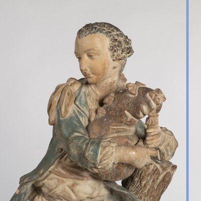 Paire de sculptures en terre cuite sur deux colonnes en bois peint en trompe-l'oeil, XIXe