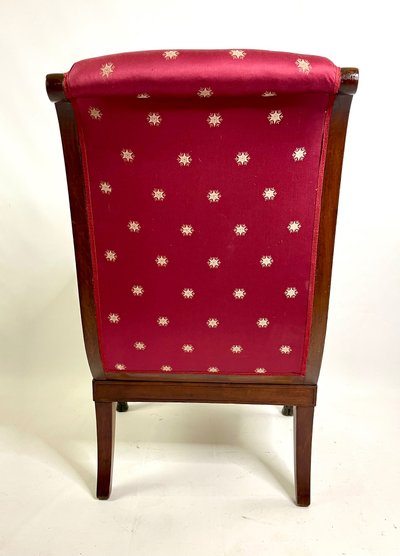 Empire-style square armchair with carved Egyptian figures, attributable to a Paris workshop
