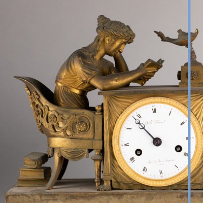 "La liseuse" clock in gilded bronze and green marble, 19th century