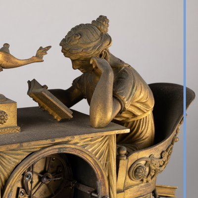 "La liseuse" clock in gilded bronze and green marble, 19th century