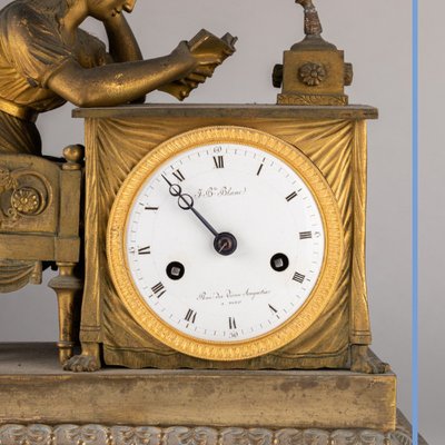 "La liseuse" clock in gilded bronze and green marble, 19th century