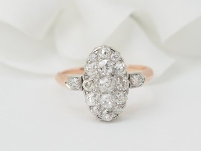 Bague ancienne pavée de diamants en or rose et platine
