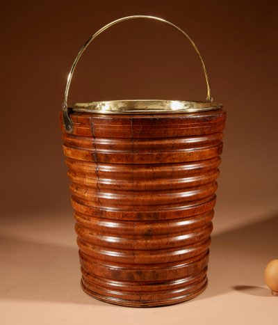 Highly decorative and original peat tea bucket in walnut, jardinière style.