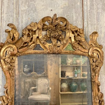 Large Provençal mirror in gilded wood 18th century