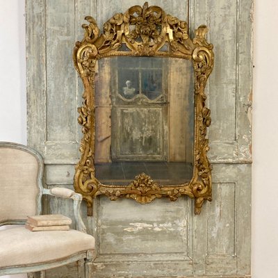 Large Provençal mirror in gilded wood 18th century