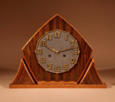 Exceptional and very elegant mantel clock, typical of the Amsterdam Art Deco school, in oak.