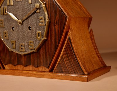 Exceptional and very elegant mantel clock, typical of the Amsterdam Art Deco school, in oak.