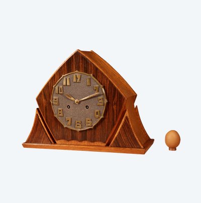 Exceptional and very elegant mantel clock, typical of the Amsterdam Art Deco school, in oak.