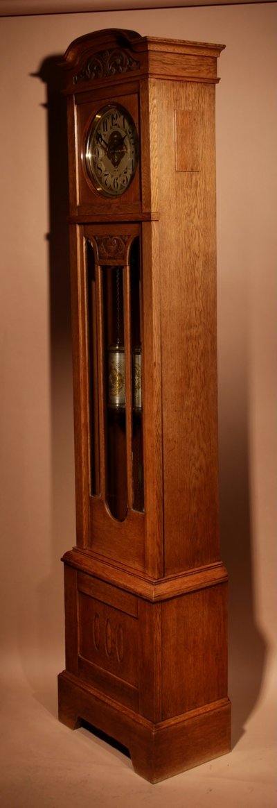 Impressive, magnificent Art Deco Dutch parquet clock in gilded oak.