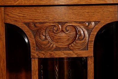 Impressive, magnificent Art Deco Dutch parquet clock in gilded oak.