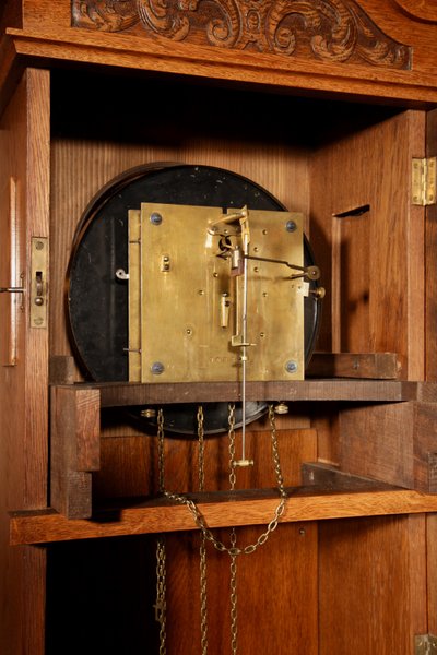 Impressive, magnificent Art Deco Dutch parquet clock in gilded oak.