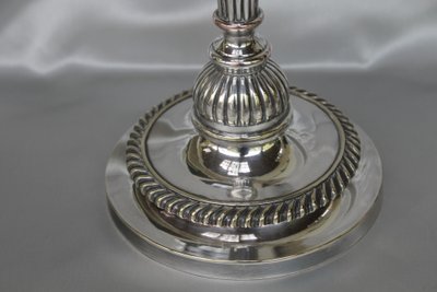 Coppia di candelieri in bronzo argentato in stile Luigi XVI, inizio XIX secolo
