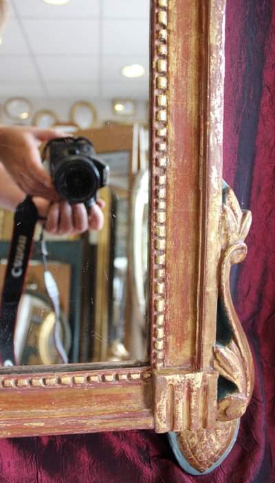 69 x 123 cm Louis XVI mirror, 18th century, carved and gilded wood