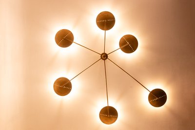 Contemporary 6-light wall sconce in patinated brass. LS6455808Z