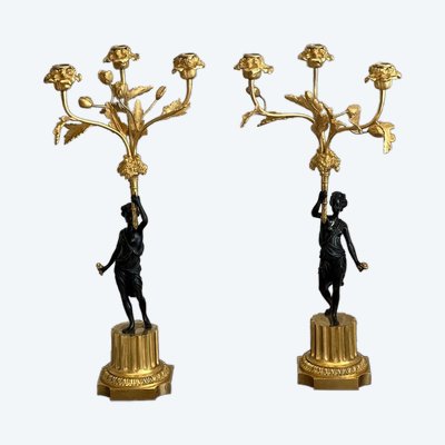 Paire de candélabres en bronze patiné et bronze doré, début du XIXème siècle.