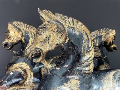 Italy, mid-20th century, pair of ornamental horses in black and gold lacquer.