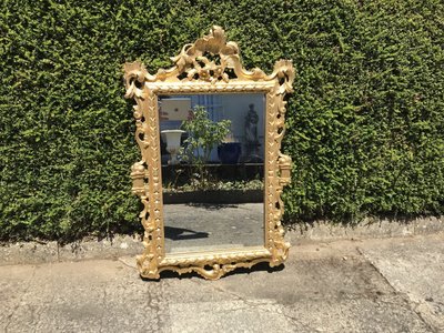 Antique Louis XV style gilded wood mirror from the 20th century