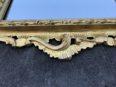 Antique Louis XV style gilded wood mirror from the 20th century
