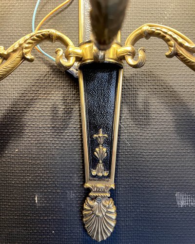 Pair of patinated bronze and gilt bronze wall lights with five arms
