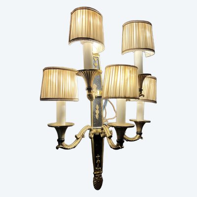 Pair of patinated bronze and gilt bronze wall lights with five arms