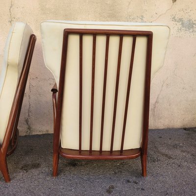 Pair of armchairs in the style of G Scapinelli, late 20th century