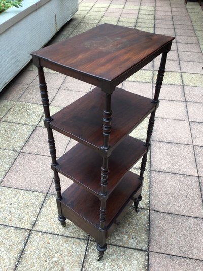 A shelf that can be used as a bookcase or a serving trolley