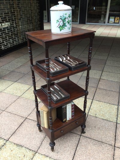 A shelf that can be used as a bookcase or a serving trolley