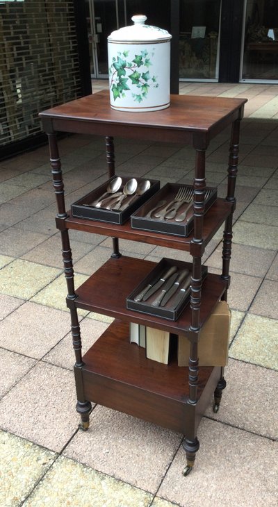 A shelf that can be used as a bookcase or a serving trolley