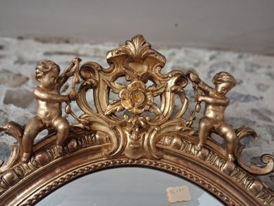 Specchiera ovale con putti XIX secolo 124 x 81