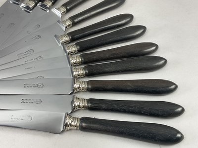 12 table knives with ebony handles and pearl decoration