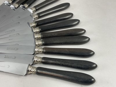 12 table knives with ebony handles and pearl decoration