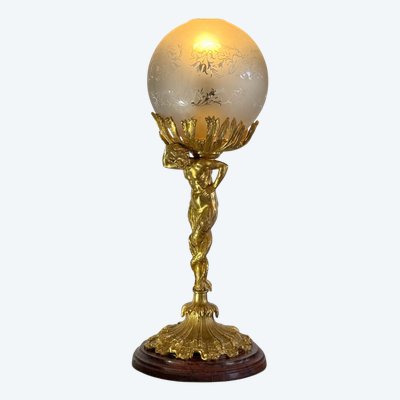 LAMPADA DEL XIX SECOLO IN BRONZO DORATO CHE RAPPRESENTA UN TRITONE CON BASE IN MARMO A DOPPIA CODA
