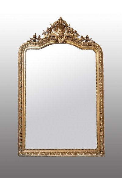 Antico specchio Napoleone III in legno dorato e intagliato. XIX secolo.