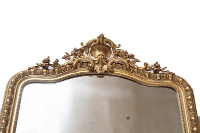 Antico specchio Napoleone III in legno dorato e intagliato. XIX secolo.