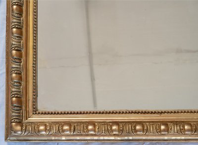 Antico specchio Napoleone III in legno dorato e intagliato. XIX secolo.