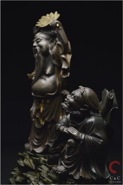 China, Qing Dynasty, 19th century, Polychrome lacquered wood group representing two Immortals