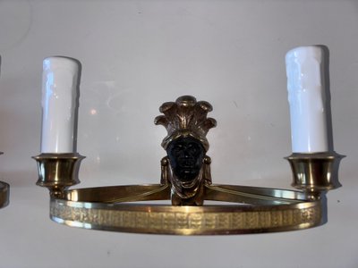Maison BAGUES, Aux Indiens wall lights in gilded and patinated bronze