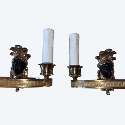 Maison BAGUES, Aux Indiens wall lights in gilded and patinated bronze