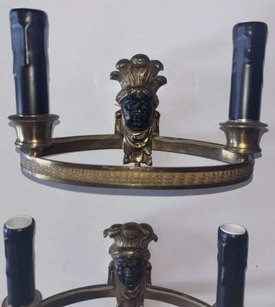 Maison BAGUES, Aux Indiens wall lights in gilded and patinated bronze