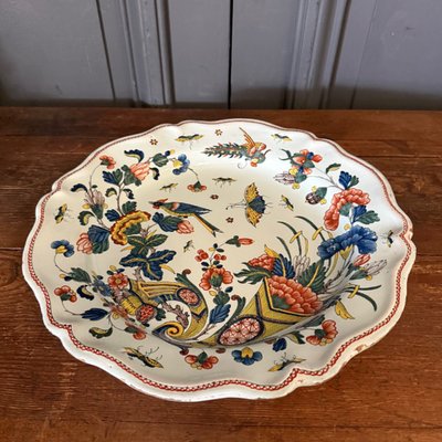 Large dish in Rouen earthenware, polychrome cornucopia 18th century