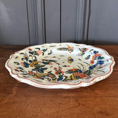 Large dish in Rouen earthenware, polychrome cornucopia 18th century