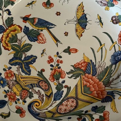 Large dish in Rouen earthenware, polychrome cornucopia 18th century