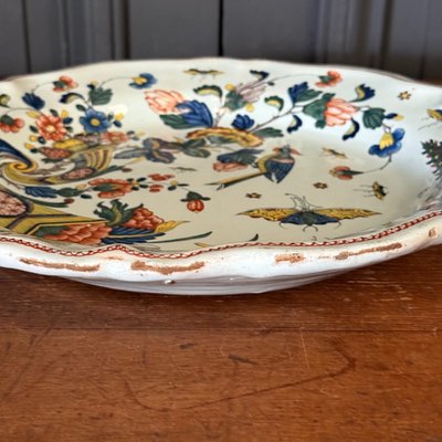 Large dish in Rouen earthenware, polychrome cornucopia 18th century