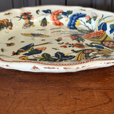 Large dish in Rouen earthenware, polychrome cornucopia 18th century