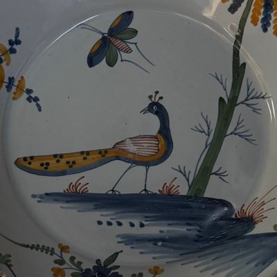 18th century La Rochelle earthenware plate with peacock and butterfly design