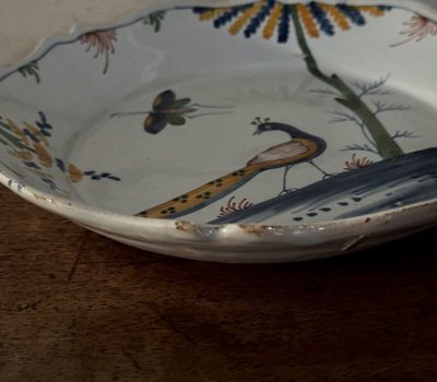 18th century La Rochelle earthenware plate with peacock and butterfly design
